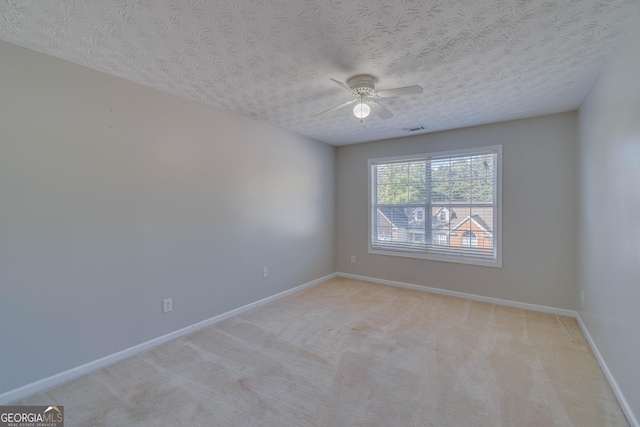 981 Charles Hall Dr, Dacula, GA 30019 - spare room with visible vents, a ceiling fan, baseboards, and light colored carpet