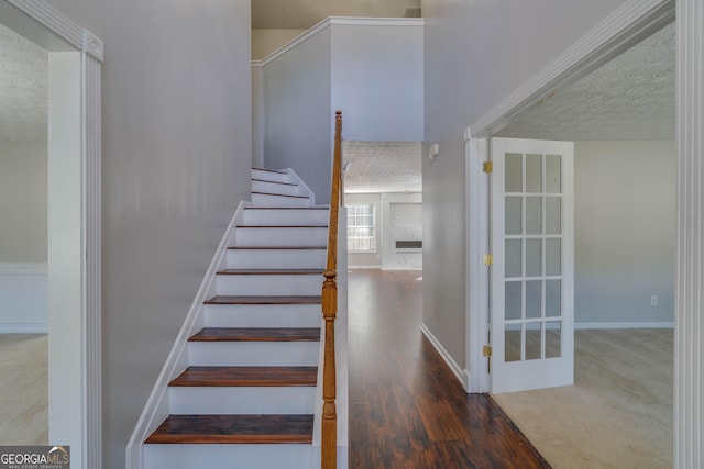 981 Charles Hall Dr, Dacula, GA 30019 - stairway featuring wood finished floors and a textured ceiling