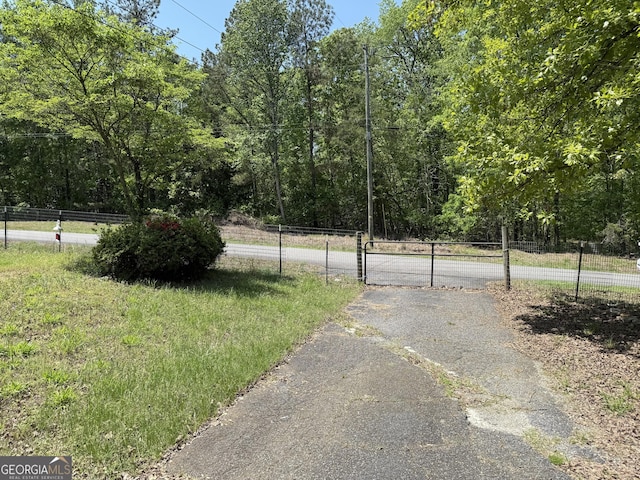 7260 Cox Rd, Cumming, GA 30028 - view of road featuring a gate
