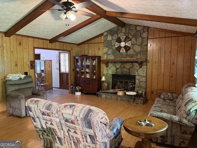 7260 Cox Rd, Cumming, GA 30028 - living room featuring vaulted ceiling with beams, ceiling fan, and wood finished floors