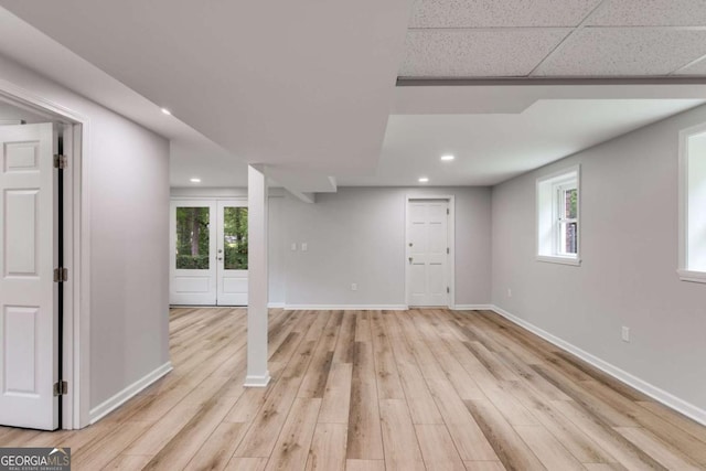 below grade area featuring recessed lighting, light wood-style flooring, and baseboards