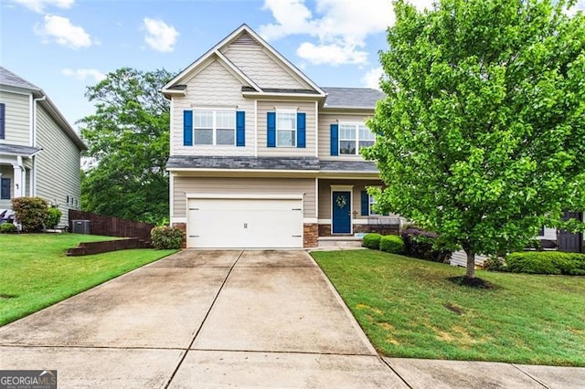 craftsman-style home featuring concrete driveway, an attached garage, and a front lawn