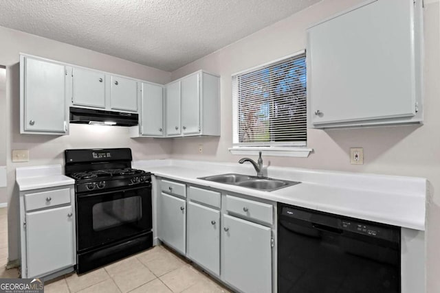 1056 Park W Ct, Stone Mountain, GA 30088 - kitchen with under cabinet range hood, a textured ceiling, a sink, and black appliances