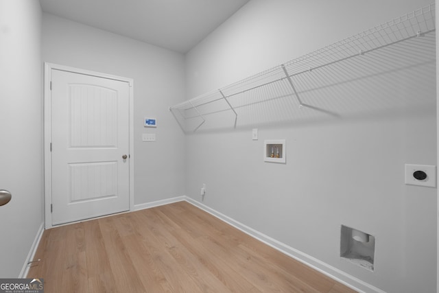 washroom with laundry area, light wood-style floors, hookup for a washing machine, baseboards, and electric dryer hookup
