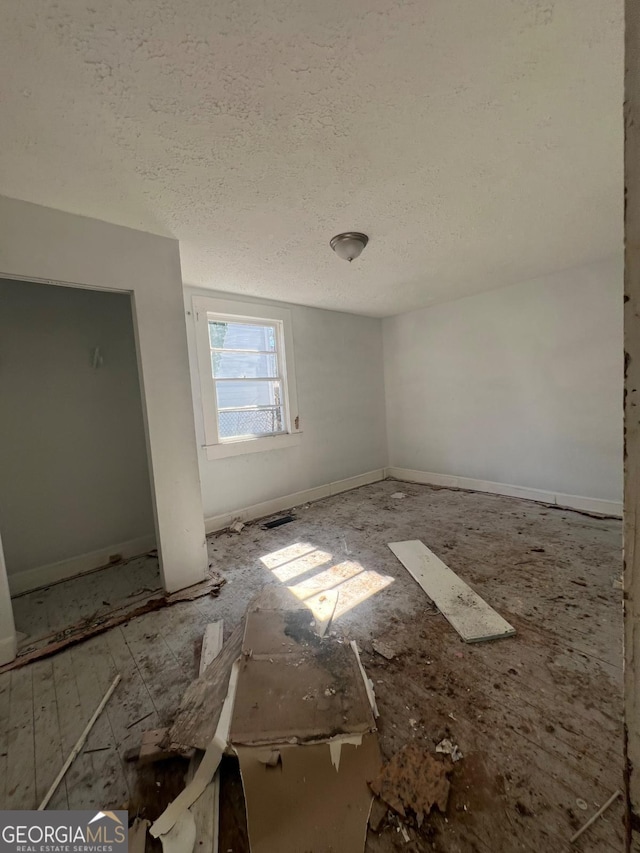 923 Ira St SW, Atlanta, GA 30310 - spare room featuring baseboards and a textured ceiling
