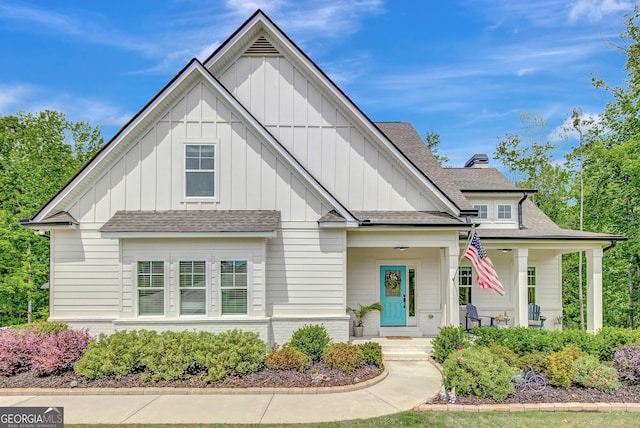 34 Oakleigh Trl, Newnan, GA 30265 - modern farmhouse style home featuring roof with shingles, covered porch, and board and batten siding
