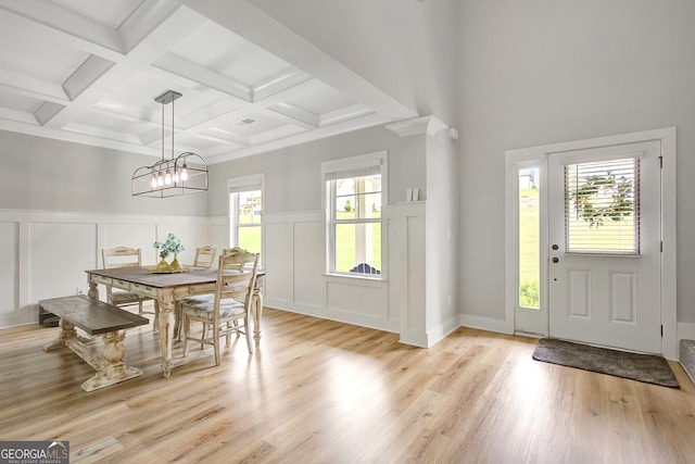 34 Oakleigh Trl, Newnan, GA 30265 - dining area featuring a decorative wall, light wood-type flooring, beamed ceiling, an inviting chandelier, and coffered ceiling