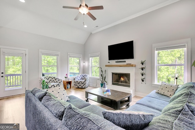 34 Oakleigh Trl, Newnan, GA 30265 - living room featuring visible vents, a ceiling fan, lofted ceiling, and a healthy amount of sunlight