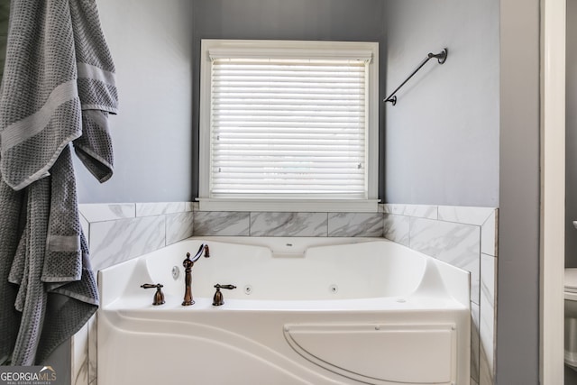 102 Wooded Glen Ln, Carrollton, GA 30117 - bathroom with toilet and a tub with jets