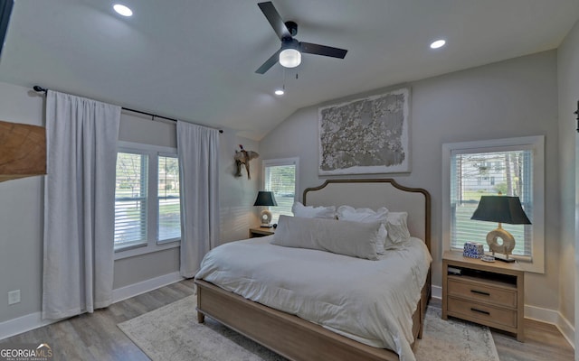 bedroom with recessed lighting, baseboards, vaulted ceiling, and wood finished floors