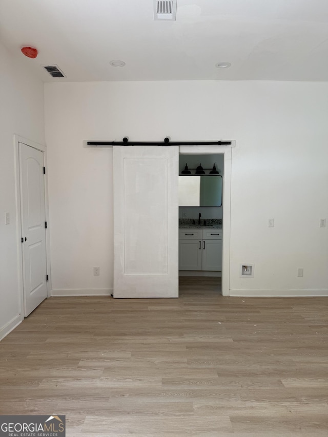 808 Center St, Macon, GA 31217 - unfurnished bedroom with light wood-style flooring and baseboards