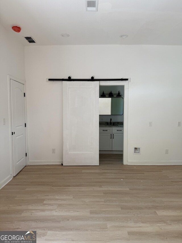 808 Center St, Macon, GA 31217 - unfurnished bedroom featuring light wood finished floors and baseboards