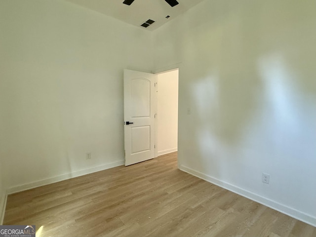 808 Center St, Macon, GA 31217 - unfurnished room featuring light wood-style flooring, a ceiling fan, and baseboards