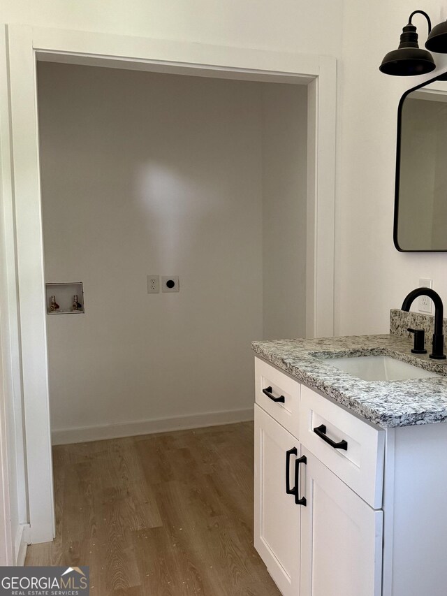 808 Center St, Macon, GA 31217 - spare room featuring light wood-type flooring, a ceiling fan, and baseboards