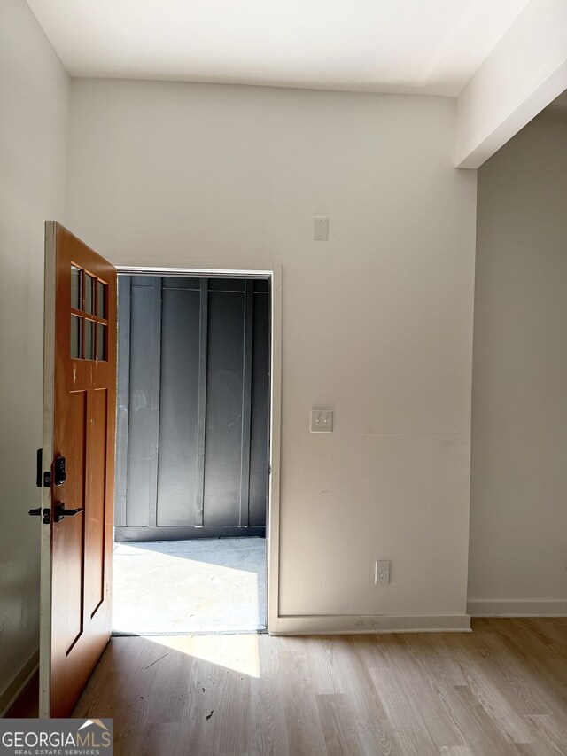 808 Center St, Macon, GA 31217 - spare room featuring wood finished floors and baseboards