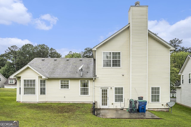 436 Berkshire Pl, Fairburn, GA 30213 - back of property featuring a patio, a lawn, and a chimney