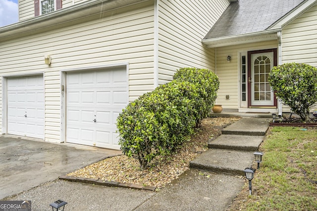 436 Berkshire Pl, Fairburn, GA 30213 - entrance to property featuring a garage, concrete driveway, and a shingled roof