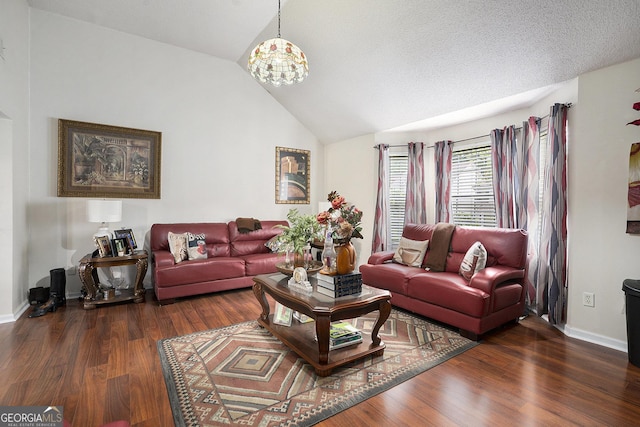 436 Berkshire Pl, Fairburn, GA 30213 - living room with lofted ceiling, wood finished floors, a chandelier, and baseboards