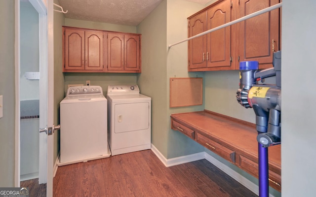 119 Ridgemore Cir, Toccoa, GA 30577 - laundry area with separate washer and dryer, dark wood-style flooring, cabinet space, and a textured ceiling