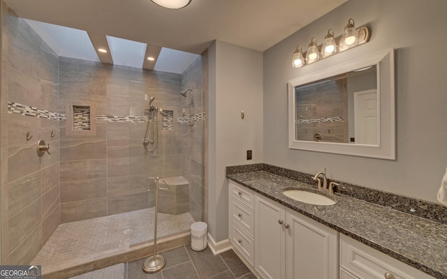 119 Ridgemore Cir, Toccoa, GA 30577 - bathroom featuring vanity, a tile shower, tile patterned floors, and recessed lighting