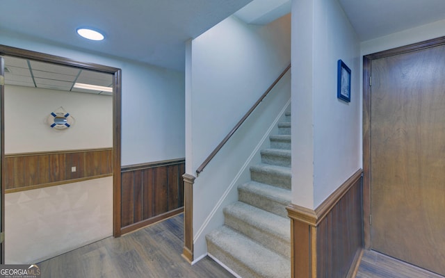 119 Ridgemore Cir, Toccoa, GA 30577 - staircase with a wainscoted wall, wood finished floors, and wood walls