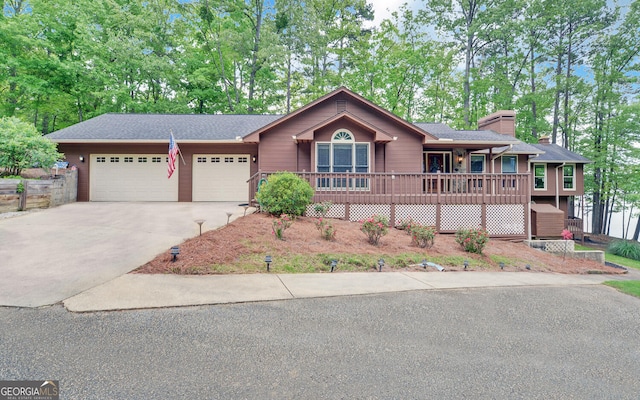 119 Ridgemore Cir, Toccoa, GA 30577 - ranch-style house featuring concrete driveway, a garage, covered porch, and a chimney