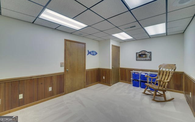 119 Ridgemore Cir, Toccoa, GA 30577 - sitting room featuring wainscoting, a paneled ceiling, wood walls, and carpet flooring