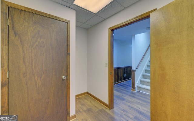 119 Ridgemore Cir, Toccoa, GA 30577 - hallway with wood finished floors, baseboards, a drop ceiling, and stairway