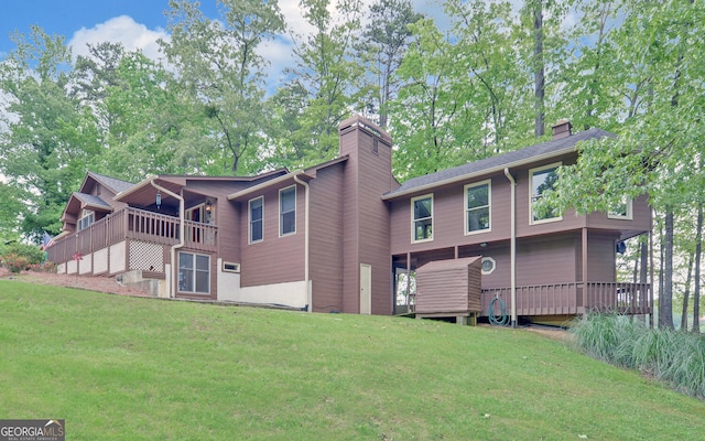 119 Ridgemore Cir, Toccoa, GA 30577 - back of property featuring a chimney, a lawn, and a wooden deck