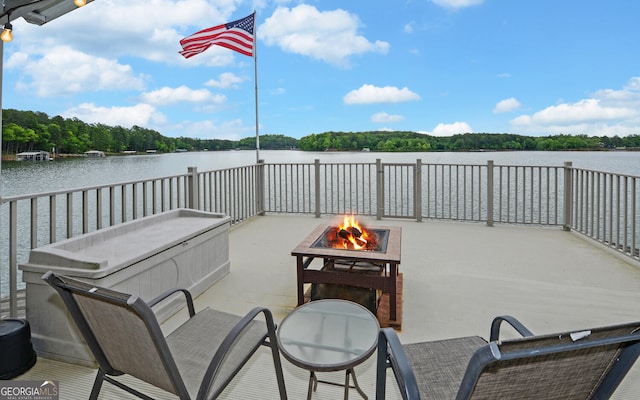 119 Ridgemore Cir, Toccoa, GA 30577 - view of patio / terrace with an outdoor fire pit, a water view, and a wooded view