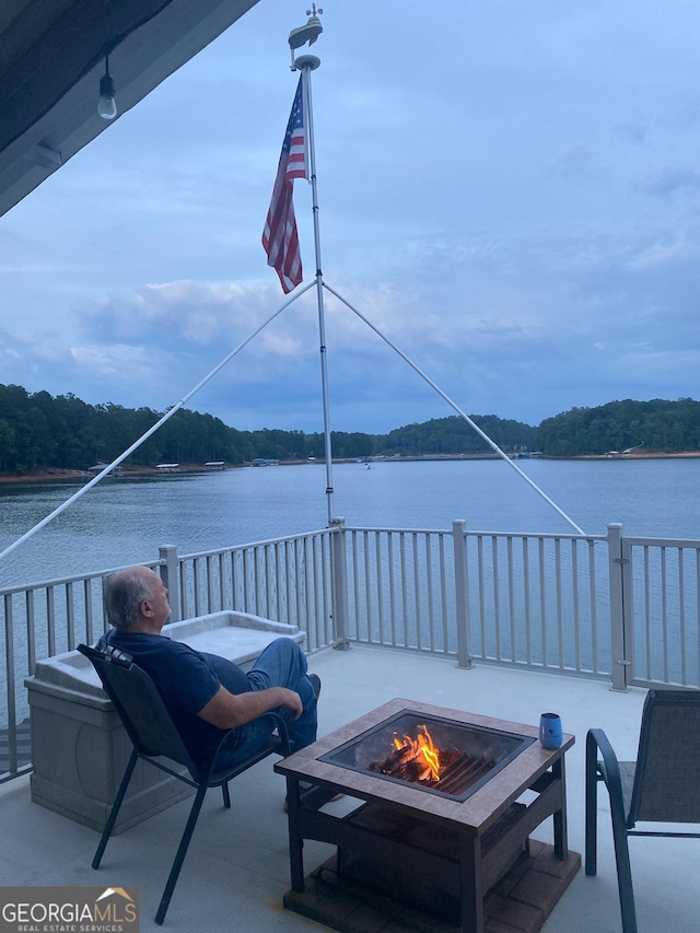119 Ridgemore Cir, Toccoa, GA 30577 - view of patio featuring an outdoor fire pit and a water view