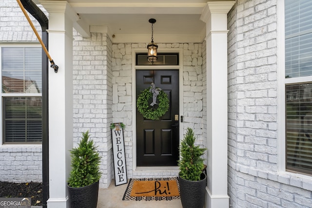 721 Paint Horse Dr, Canton, GA 30115 - doorway to property featuring brick siding and a porch