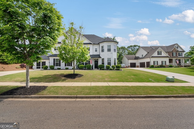 721 Paint Horse Dr, Canton, GA 30115 - french country style house featuring a front yard, driveway, and a garage