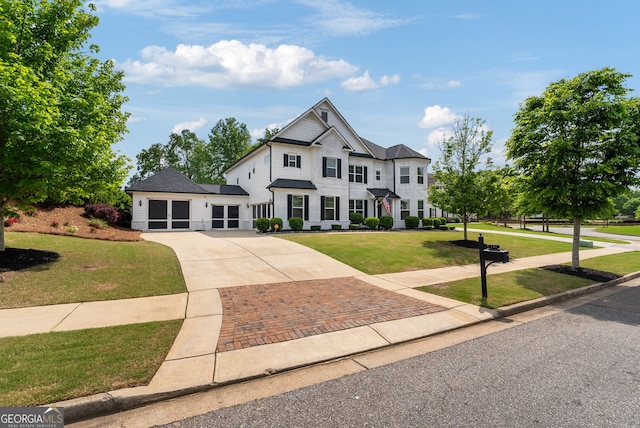 721 Paint Horse Dr, Canton, GA 30115 - colonial-style house featuring concrete driveway and a front yard