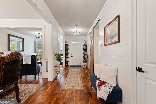 721 Paint Horse Dr, Canton, GA 30115 - foyer entrance with dark wood-style flooring, ornamental molding, and a barn door