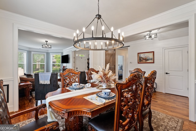 721 Paint Horse Dr, Canton, GA 30115 - dining area featuring a chandelier, wood finished floors, and crown molding