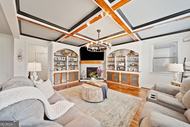 721 Paint Horse Dr, Canton, GA 30115 - living area with a chandelier, wood finished floors, coffered ceiling, a fireplace, and beamed ceiling