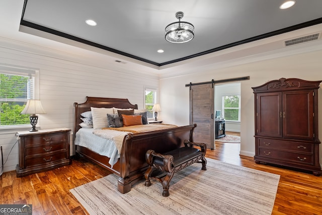 721 Paint Horse Dr, Canton, GA 30115 - bedroom with ornamental molding, multiple windows, wood finished floors, a barn door, and recessed lighting