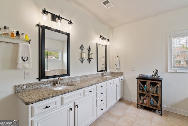 721 Paint Horse Dr, Canton, GA 30115 - bathroom with healthy amount of natural light, baseboards, double vanity, and tile patterned flooring