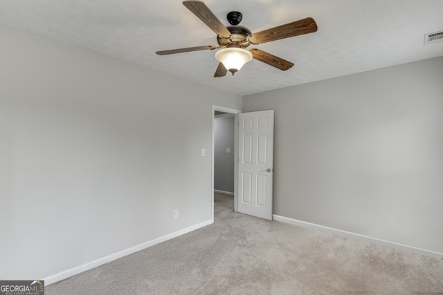 5922 Terrace Lake Pt, Flowery Branch, GA 30542 - empty room with light carpet, a ceiling fan, and a textured ceiling