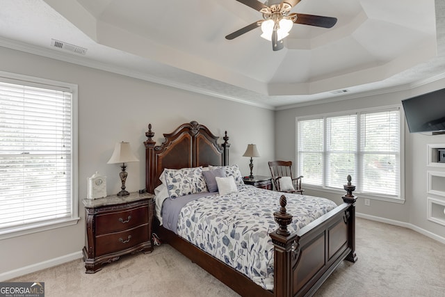 5922 Terrace Lake Pt, Flowery Branch, GA 30542 - bedroom featuring a tray ceiling, light colored carpet, a ceiling fan, and ornamental molding