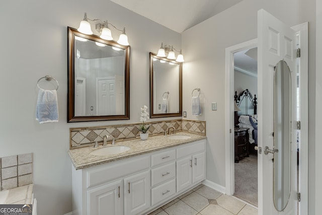 5922 Terrace Lake Pt, Flowery Branch, GA 30542 - ensuite bathroom with double vanity, backsplash, and tile patterned floors