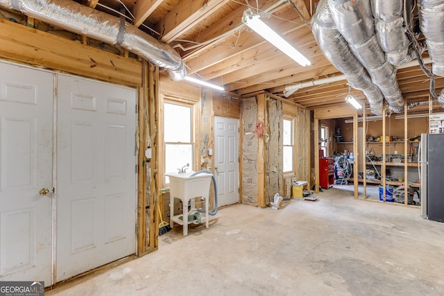 5922 Terrace Lake Pt, Flowery Branch, GA 30542 - below grade area with healthy amount of natural light and freestanding refrigerator