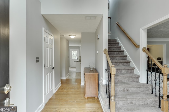 5922 Terrace Lake Pt, Flowery Branch, GA 30542 - staircase with wood finished floors and baseboards