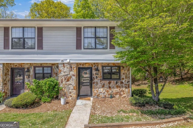 traditional home with stone siding