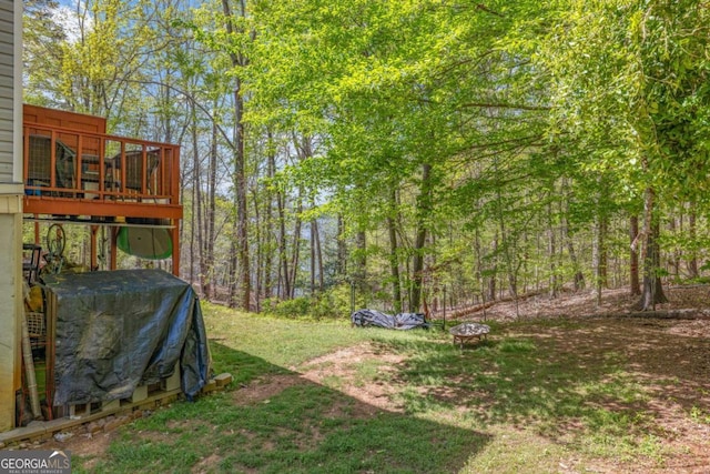 view of yard featuring a wooden deck