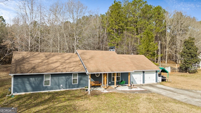 view of front of property featuring a porch, a front lawn, an attached garage, and concrete driveway