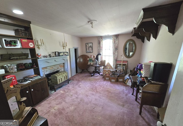 carpeted living area with a fireplace