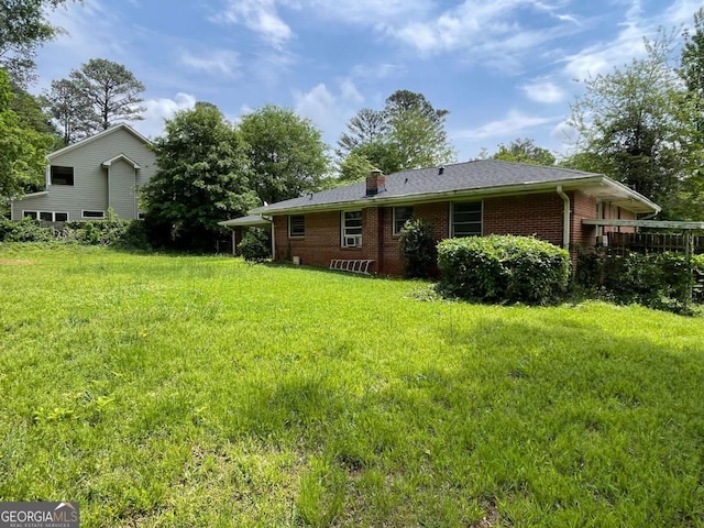 2988 Ramble Ln, Decatur, GA 30033 - back of house featuring brick siding, a yard, and a chimney