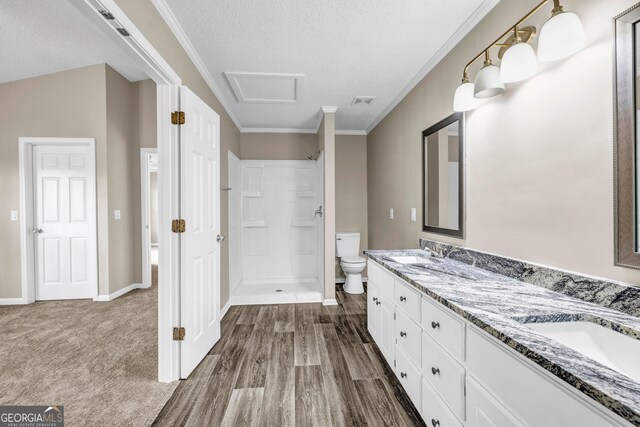 60 Whispering Pine Ct, Covington, GA 30016 - bathroom with toilet, a shower, a textured ceiling, double vanity, and ornamental molding
